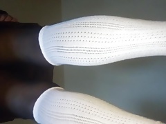 White socks worn over black tights