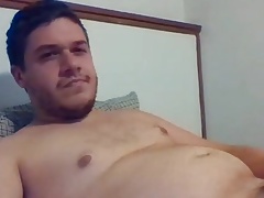 Chubby gay guy plays with his nipple